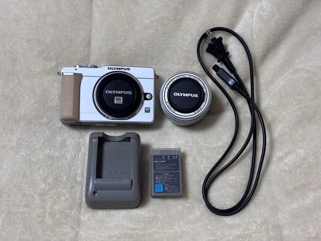 Máy ảnh phản chiếu ống kính đơn không gương lật olympus pen e-pl1s